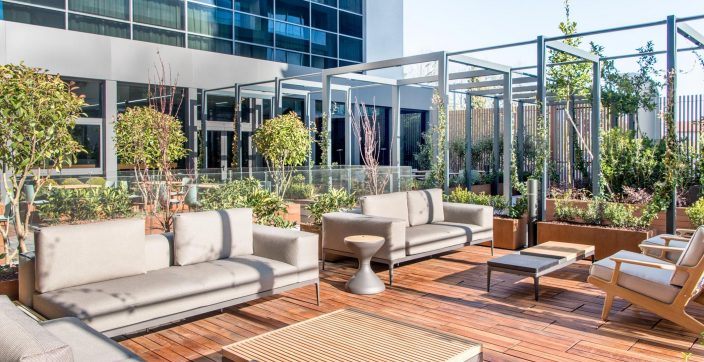sofas and tables near building