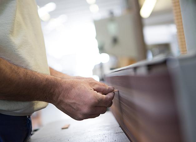 person holding cutout wood
