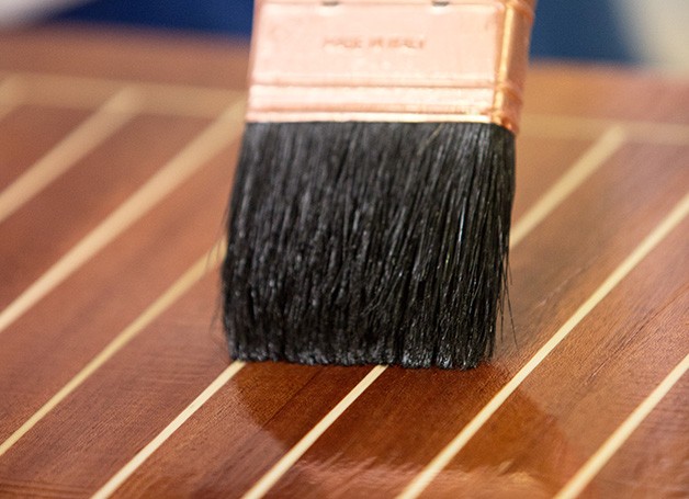 paint brush brushing wood