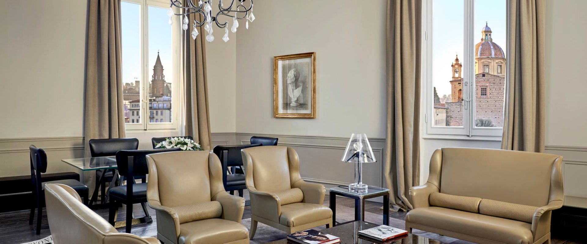 gray leather couch and armchairs in room