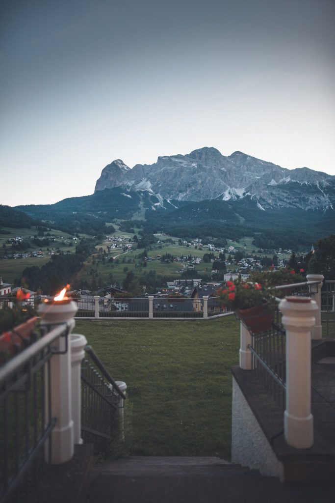 gray rock mountain overlooking town