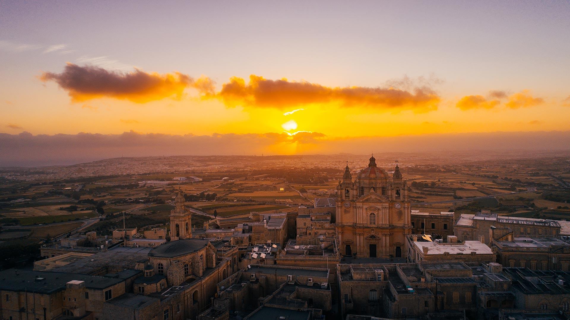 Aerial view of the walled city of Mdina at sunrise